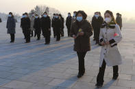 Pyongyang citizens visit Mansu Hill to pay respect to the statues of their late leaders Kim Il Sung and Kim Jong Il on the occasion of the 75th founding anniversary of the Korean People's Army in Pyongyang, North Korea Wednesday, Feb. 8, 2023. (AP Photo/Jon Chol Jin)