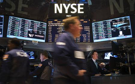 Traders work on the floor of the New York Stock Exchange after the opening bell October 9, 2013. REUTERS/Adrees Latif