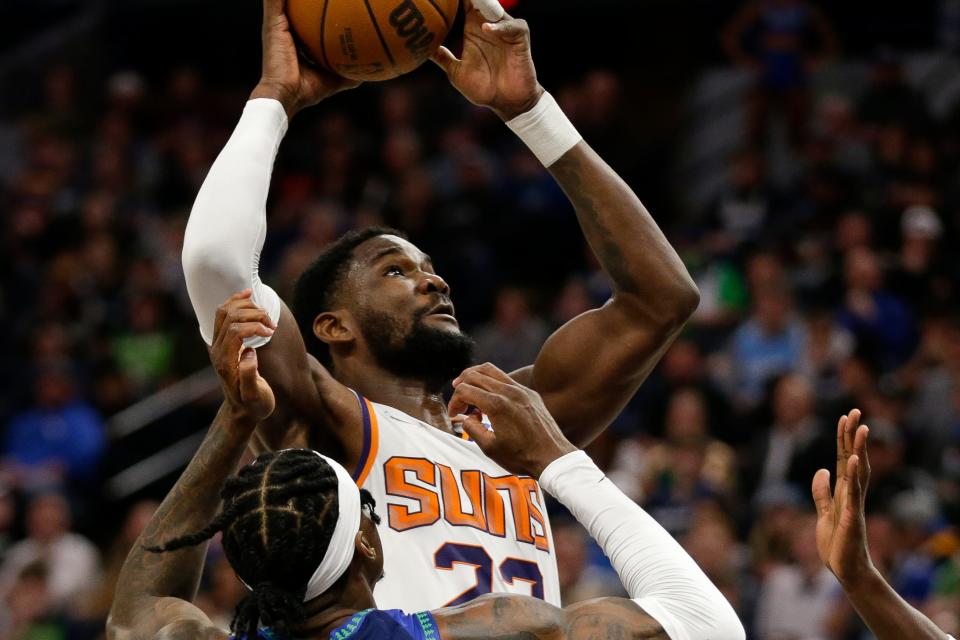 Phoenix Suns center Deandre Ayton shoots during an NBA basketball game against the Minnesota Timberwolves Wednesday, March 23, 2022, in Minneapolis.