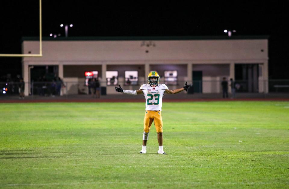 Coachella Valley's Aaron Ramirez (23) celebrates what would become the last offensive drive of the game during the fourth quarter of their game at Palo Verde High School in Blythe, Calif., Friday, Aug. 25, 2023.