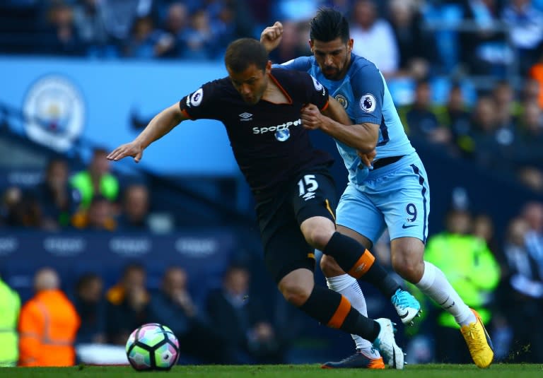 Hull City's Shaun Maloney (L) vies with Manchester City's Nolito during their match at the Etihad Stadium in Manchester, north west England, on April 8, 2017