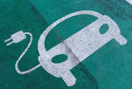 A sign is pictured on an electric car charging station at the United Nations in Geneva, Switzerland June 2, 2017. REUTERS/Denis Balibouse