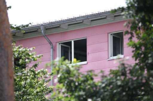 An open window at the house where a gunman took several people hostage in Karlsruhe, southwestern Germany. Five people were left dead after a hostage-taking during a home eviction in Karlsruhe, including the presumed gunman