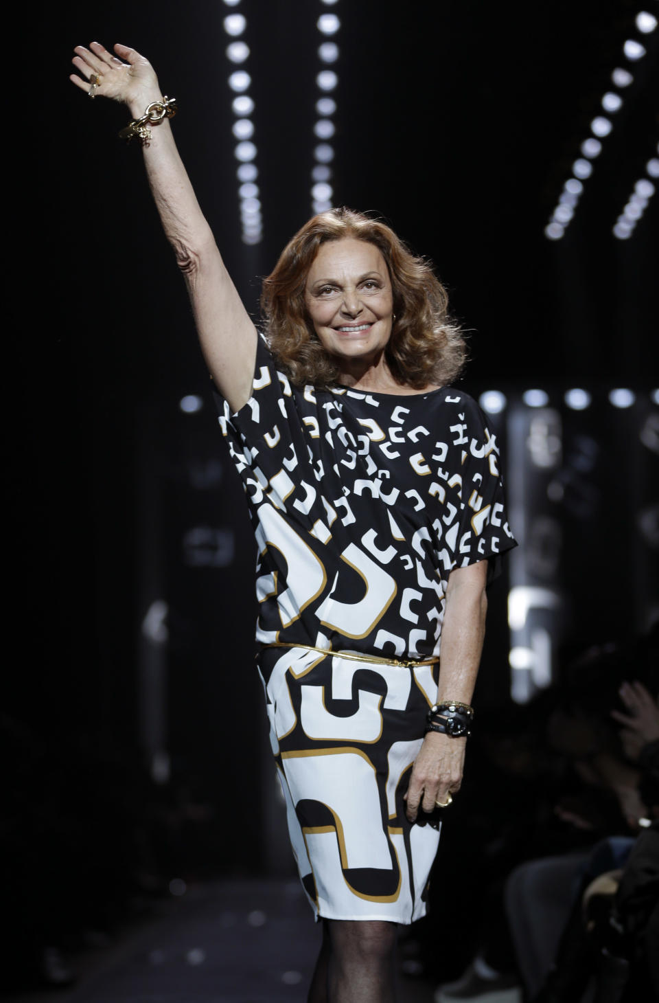 Diane von Furstenberg greets the crowd after showing her Fall 2013 collection during Fashion Week in New York, Sunday, Feb. 10, 2013. (AP Photo/Seth Wenig)