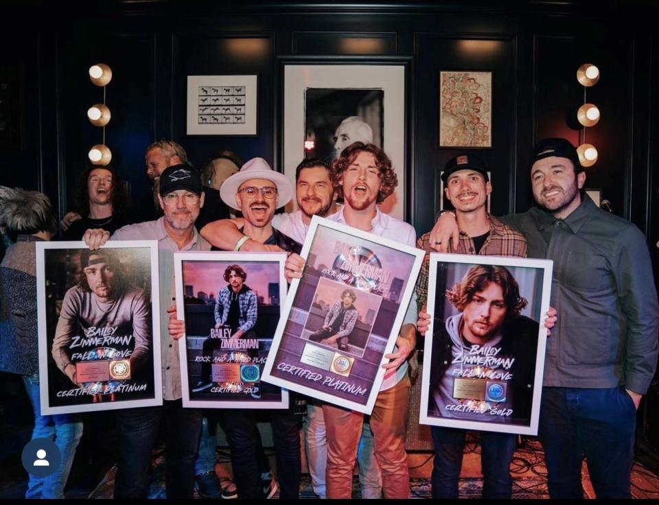 Scott Frazier, left, is a Louisville-based manager for 10th Street Entertainment in Los Angeles. Here he's pictured with his client, Bailey Zimmerman, center, who's at a plaque presentation for “Fall in Love” and “Rock and a Hard Place,” which were certified gold and platinum. 

“Fall in Love” reached #1 at country radio and the follow up “Rock and a Hard Place “ as of this week lands at Top 20 at both Airplay Charts in 5 weeks!