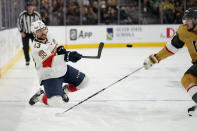 Florida Panthers center Sam Reinhart (13) passes against the Vegas Golden Knights during the third period of Game 2 of the NHL hockey Stanley Cup Finals, Monday, June 5, 2023, in Las Vegas. (AP Photo/John Locher)