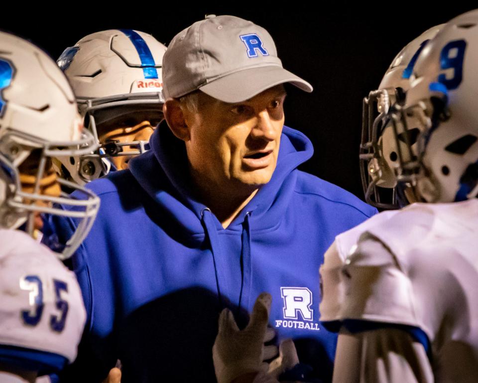 Rick Rice talks to Rockvale players during a 2021 playoff game vs. Shelbyville. Rice was named head coach at McEwen Monday.