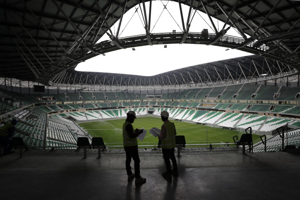 Site engineers work at the Qatar Education Stadium, one of the 2022 World Cup stadiums, an open cooled stadium with a 45,350-seat capacity in Doha, Qatar, Dec. 15, 2019. A former CIA officer who spied on Qatar’s rivals to help the tiny Arab country land this year’s World Cup is now under FBI scrutiny and newly obtained documents show he offered clandestine services that went beyond soccer to try to influence U.S. policy, (AP Photo/Hassan Ammar)