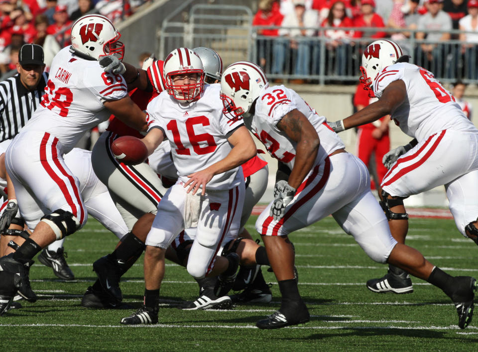 Oct 10, 2009; Columbus, OH, USA; Wisconsin Badgers quarterback Scott Tolzien (16) hands the ball off to running back John Clay (32)against the Ohio State Buckeyes at Ohio Stadium. Mandatory Credit: Matthew Emmons-USA TODAY Sports