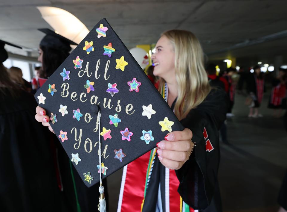 Remi Shultz shows her cap with stars from her student teaching students during the University of Utah’s commencement in Salt Lake City on Thursday, May 4, 2023. With 8,723 graduates, it is the largest group of graduates in the school’s history. | Jeffrey D. Allred, Deseret News