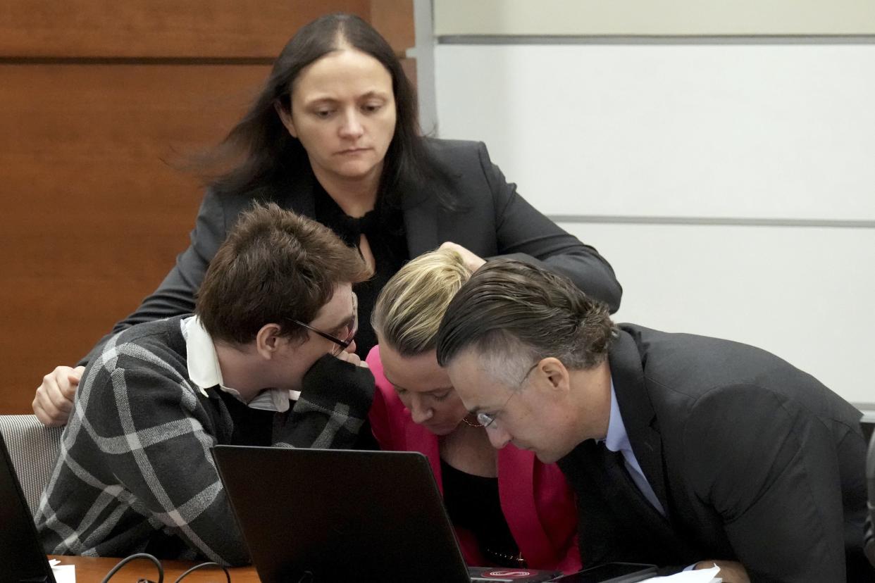 Marjory Stoneman Douglas High School shooter Nikolas Cruz, left, speaks with members of his defense team after Judge Elizabeth Scherer asked him if he was sure he wants to rest his case and waive his right to have more witnesses testify during the penalty phase of Cruz's trial at the Broward County Courthouse in Fort Lauderdale on Wednesday, Sept. 14, 2022. 