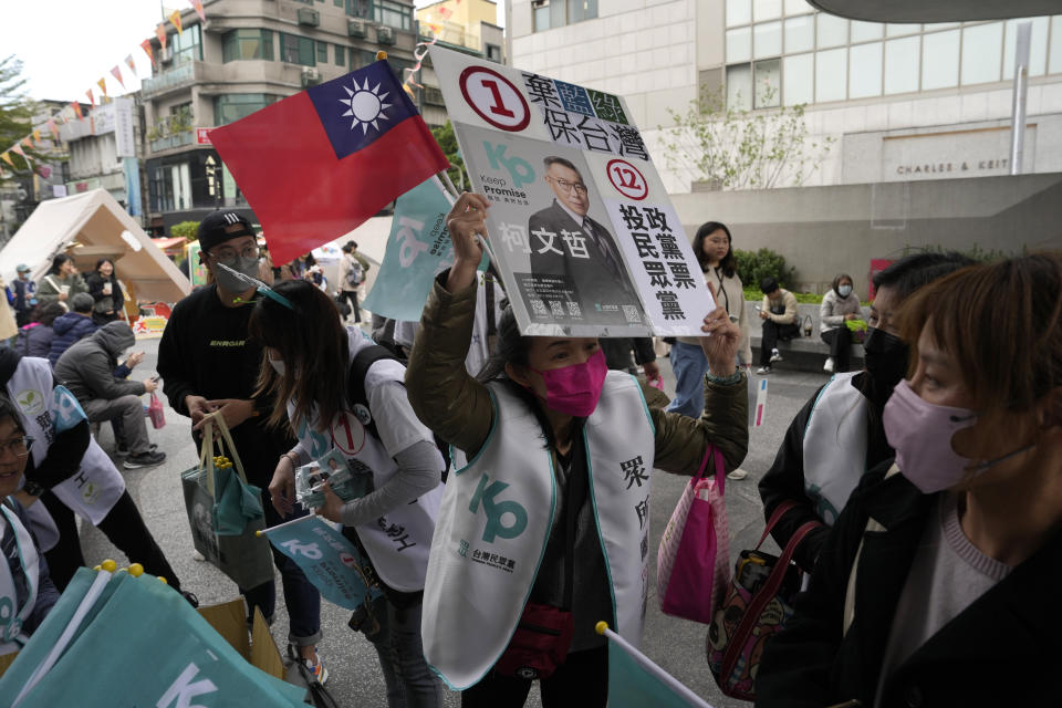 Supporters of Ko Wen-je, Taiwan People's Party (TPP) presidential candidate, canvass for votes in Taipei, Taiwan on Sunday, Jan. 7, 2024. With Taiwan's high-stakes presidential election just days away, the nonconformist candidate has been resonating with the island's youth, seemingly more concerned with the dearth of good jobs and affordable housing than the looming threat from China. (AP Photo/Ng Han Guan)