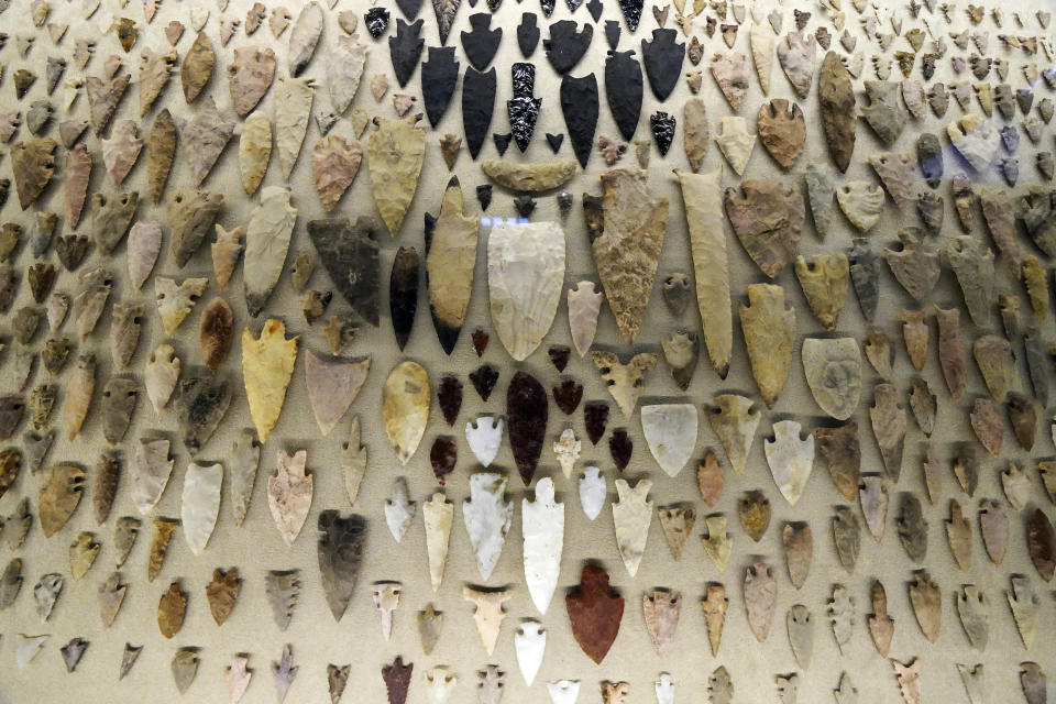 A collection of arrowheads are shown as part of the exhibition "The Greatness of Mexico" displaying for the first time in the country more than 800 pieces repatriated from abroad in the last three years and others that were in safekeeping and confiscation warehouses, at the Anthropology Museum in Mexico City, Friday, Oct. 1, 2021. (AP Photo/Marco Ugarte)