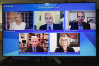 A screen shows Francine Lacqua, moderator, Richard Hatchett, CEO of the Coalition for Epidemic Preparedness and Innovations (CEPI), Stephane Bancel, CEO of Moderna, Anthony S. Fauci, Director of the National Institute of Allergy and Infectious Diseases (NIAID) at the U.S.A., and Annelies Wilder-Smith, Professor at the School of Hygiene and Tropical Medecine, during a remotely panel titled "COVID 19: What's Next?" at the Davos Agenda 2022, in Cologny near Geneva, Switzerland, Monday, Jan. 17, 2022. The Davos Agenda, which takes place from Jan. 17 to Jan. 21, 2022, is an online edition of the annual Davos meeting of the World Economy Forum due to the coronavirus pandemic. (Salvatore Di Nolfi/Keystone via AP)