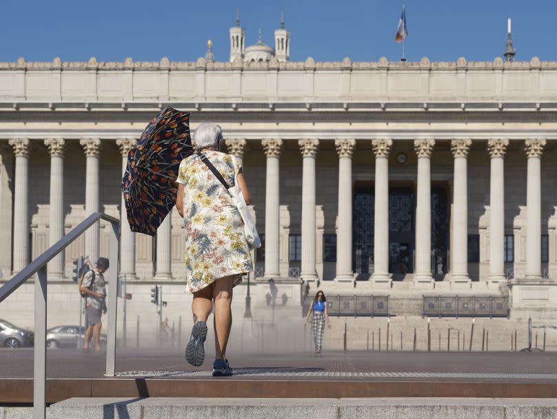 People walk in high temperatures in the center of Lyon, August 2023