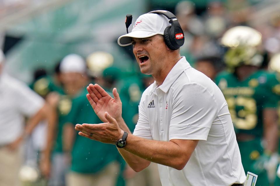 South Florida head coach Jeff Scott tries to fire up his team against Florida during the first half of an NCAA college football game Saturday, Sept. 11, 2021, in Tampa, Fla. (AP Photo/Chris O'Meara)