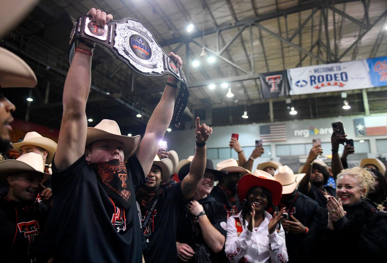 Texas Tech football players celebrate their victory over Mississippi in the Rodeo Bowl on Monday night at NRG Arena in Houston. Tech won 5-2 in the seven-event competition. The two teams meet in the Texas Bowl at 8 p.m. Wednesday at NRG Stadium.