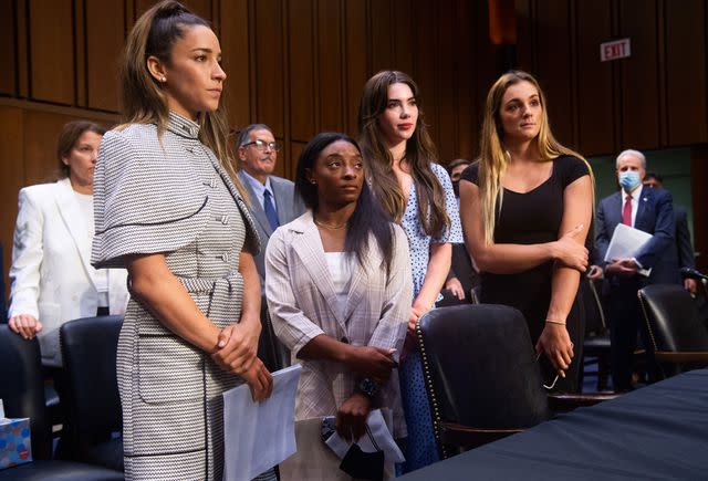 <p>Saul Loeb - Pool/Getty</p> Maggie Nichols (far right) testifying before Congress about the Larry Nassar abuse in 2021 with teammates and fellow abuse survivors Aly Raisman, Simone Biles and McKayla Maroney.