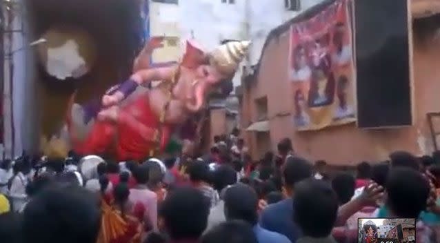 The crowd screamed as the statue tilted and then fell. Photo: YouTube