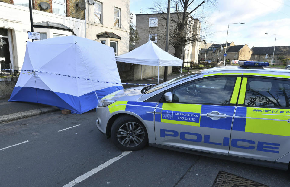 Police secure the area where a man was stabbed Wednesday evening, in the Leyton area of east London, Thursday March 7, 2019.  Britain's Prime Minister Theresa May continues to face criticism over her refusal to accept an alleged link between reduced numbers of police officers, and increases of bloodshed on Britain's streets, as another man lost his life in a fatal stabbing in the capital. (John Stillwell/PA via AP)