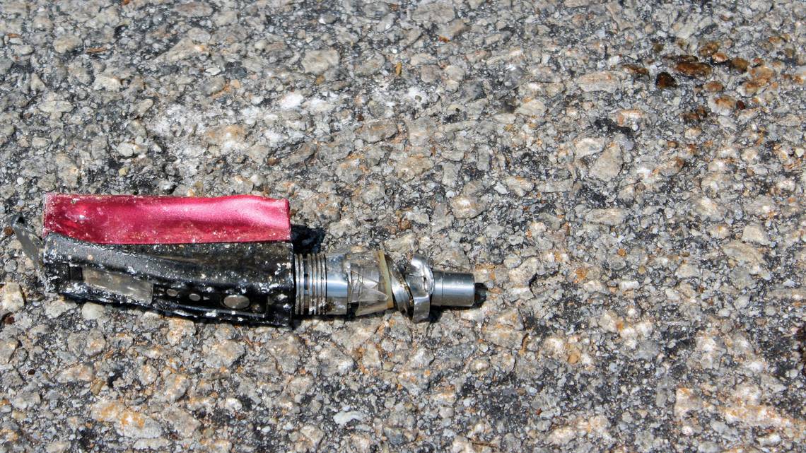 A vape mod lies crushed on a campus road at Triton High School on Thursday, June 8, 2023.
