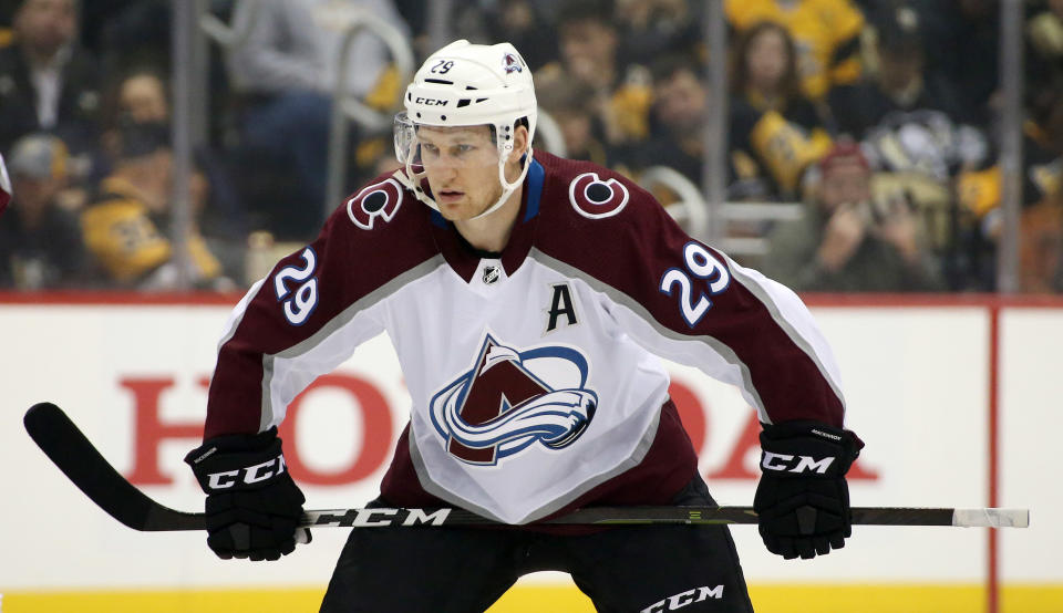 Oct 16, 2019; Pittsburgh, PA, USA;  Colorado Avalanche center Nathan MacKinnon (29) is set to take the opening face-off against the Pittsburgh Penguins during the first period at PPG PAINTS Arena. Mandatory Credit: Charles LeClaire-USA TODAY Sports