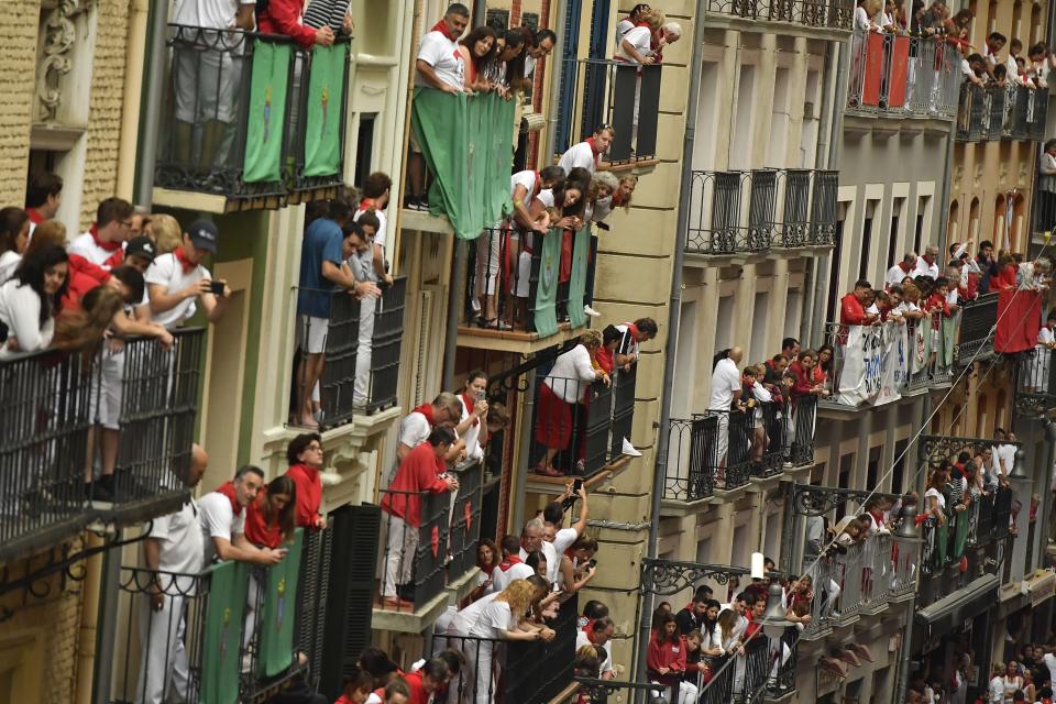 People on balconies wait for the start of the running of the bulls at the San Fermin Festival in Pamplona, northern Spain, July 9, 2019. (Photo: Alvaro Barrientos/AP)