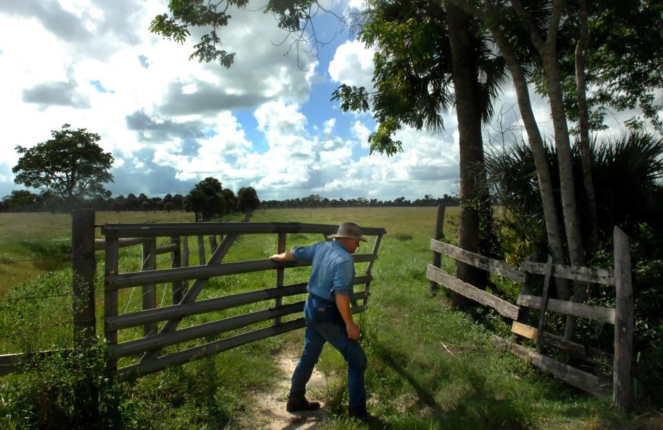 September 24, 2007 - Sean Sexton, who ran the 600-acre Treasure Hammock Ranch located in Indian River County, closed a fence leading into one of the pastures used to raise cattle on his farm. Earlier in 2007, the Sexton's sold the development rights to their plot for $12 million. "It was necessary because we could not conceive of tearing up this land and building houses and, you know, ruining it the way you see everything ruined now," said Sexton. "We've been here our whole lives. It's like a sacrament to us, this place."