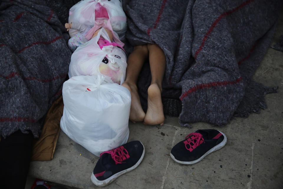 A child sleeps under a gazebo at a park in the Mexican border city of Reynosa, Saturday, March 27, 2021. (AP Photo/Dario Lopez-Mills)