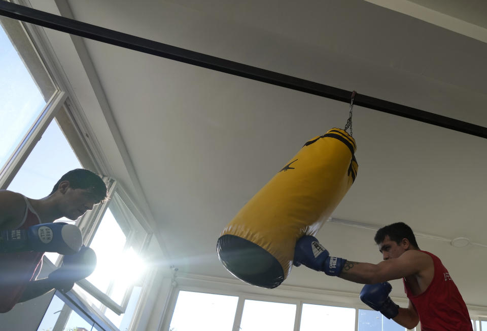 A member of the Afghan national boxing team attends a training session in local gym in Serbia, Wednesday, Dec. 1, 2021. They practiced in secrecy and sneaked out of Afghanistan to be able to compete at an international championship. Now, the Afghan boxing team are seeking refuge in the West to be able to continue both their careers and lives without danger or fear. (AP Photo/Darko Vojinovic)