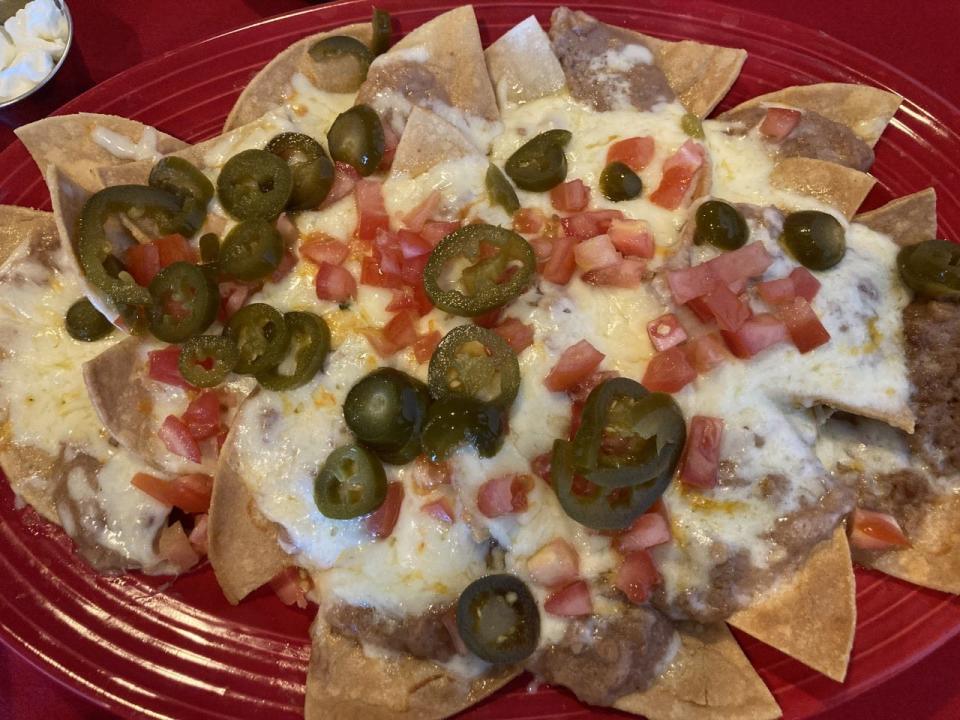 Victoria's Steakhouse and Mexican Grill offers two types of nachos: one with beef and one without. The chips are crispy and the cheese is Mexican, melting nicely on the nachos.