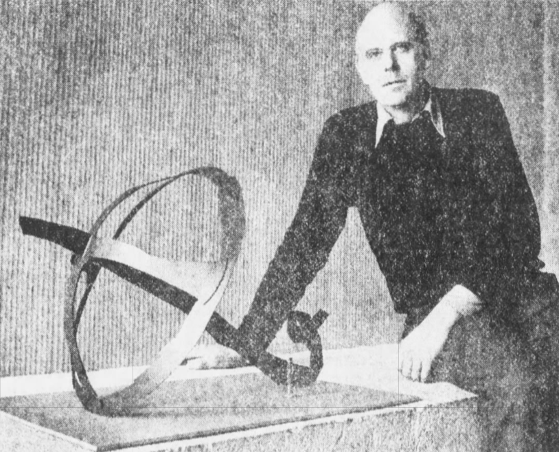 From February 1979: Sculptor Claes Oldenburg sits beside a model of his sculpture, "Crusoe Umbrella," before building the ovesized version that anchors the corner of Third and Locust streets in Des Moines.