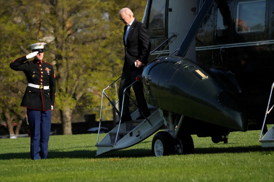 President Biden exits Marine One as he returns to Washington, D.C., from Camp David on Sunday. (Ken Cedeno/Reuters)