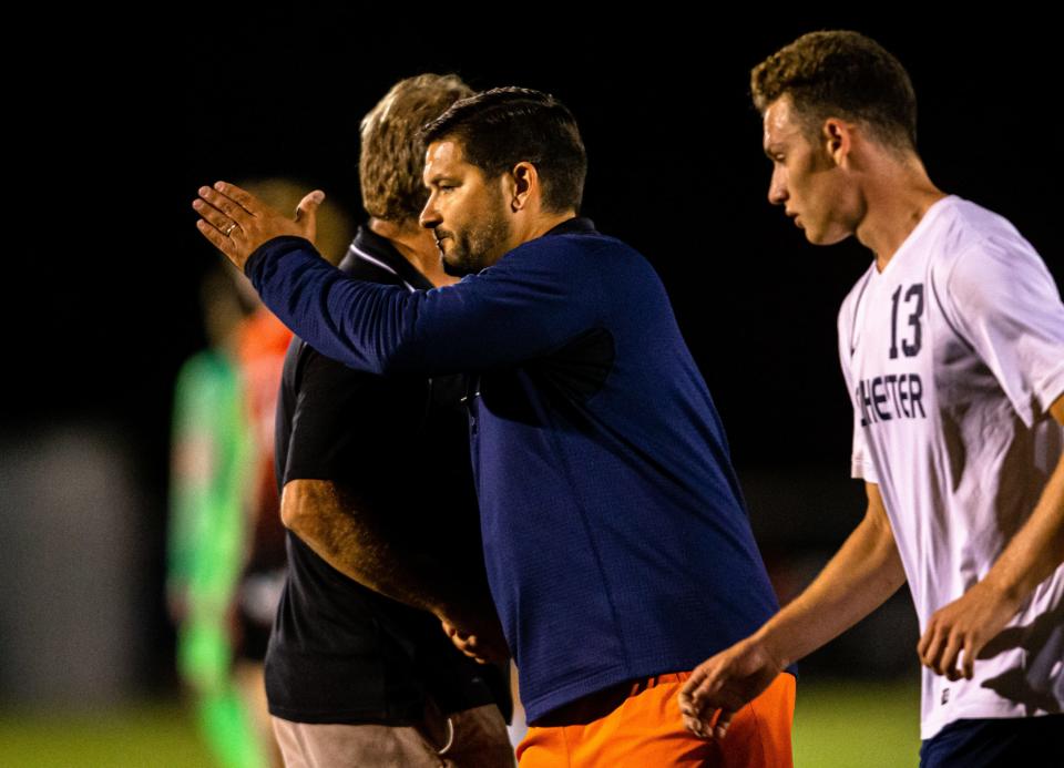 Rochester soccer head coach Chad Kutscher shakes hands with Springfield soccer head coach Pat Phillips after the Rockets defeated Springfield 2-1 at Lee Field, Tuesday, Oct. 8, 2019, in Springfield, Ill. [Justin L. Fowler/The State Journal-Register]