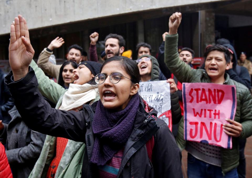 Demonstrators shout slogans during a protest against the attacks on students of New Delhi's Jawaharlal Nehru University on Sunday, in Chandigarh