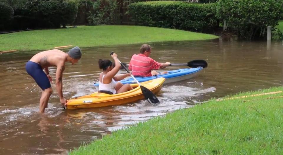 Regis Prograis (L) is shown in the aftermath of Hurricane Harvey. (Courtesy of Regis Prograis)