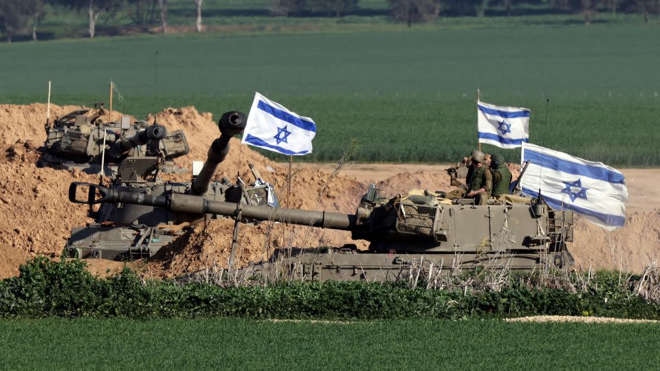 Self-propelled artillery Howitzers roll in southern Israel along the border with the Gaza Strip on January 19. - Jack Guez/AFP/Getty Images