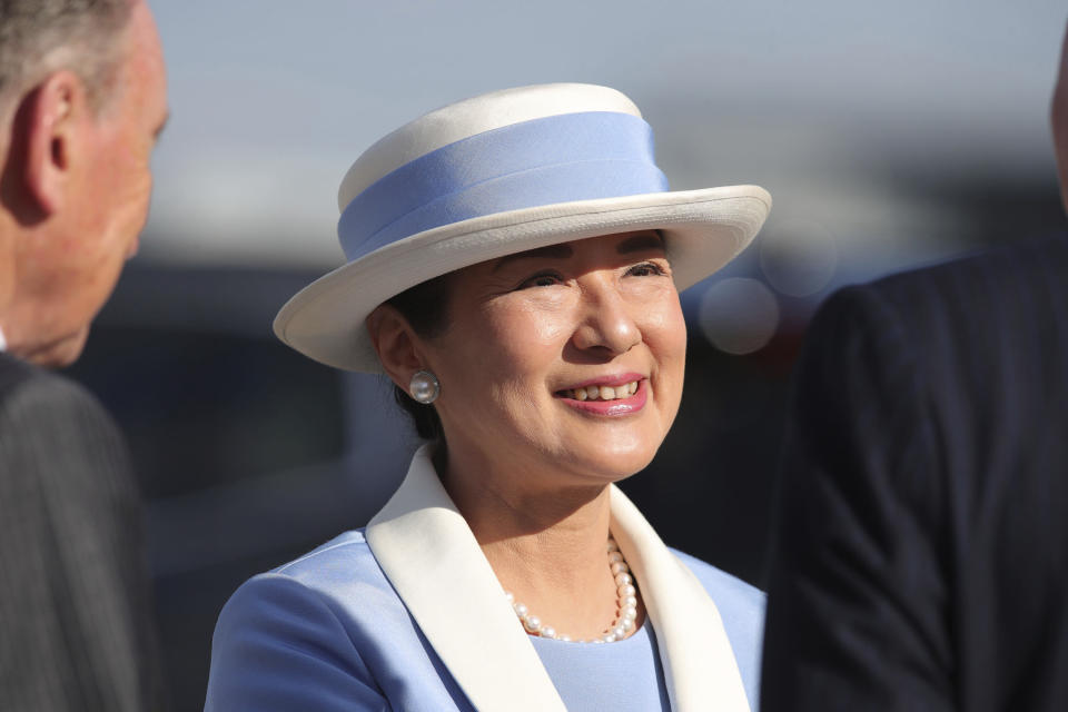 Japan Empress Masako smiles as she disembarks at Stansted Airport, England, Saturday, June 22, 2024, ahead of a state visit. The state visit begins Tuesday, when King Charles III and Queen Camilla will formally welcome the Emperor and Empress before taking a ceremonial carriage ride to Buckingham Palace. (Chris Radurn/PA via AP)