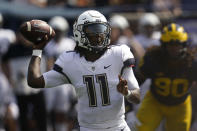 Connecticut quarterback Zion Turner (11) throws against Michigan in the first half of an NCAA college football game in Ann Arbor, Mich., Saturday, Sept. 17, 2022. (AP Photo/Paul Sancya)