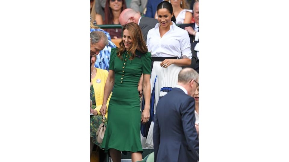 Meghan and Kate walking through stands at Wimbledon