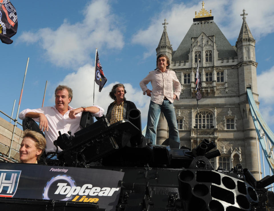 Top Gear presenters, (l-r) Jeremy Clarkson, James May and Richard Hammond, are driven across Tower Bridge in a stretched (two welded together) 434 Armoured Personel Carrier, to a Press Conference in Tower Hotel, to launch Top Gear going live (with debut at the MPH Prestige and Performance Motor Show, Earls Court in October), St Katherines Way, London.