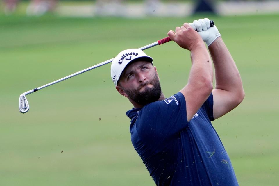 Jon Rahm hits a shot on the first fairway during third round of the Arnold Palmer Invitational golf tournament Saturday, March 4, 2023, in Orlando, Fla. (AP Photo/John Raoux)