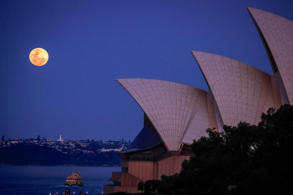 A harvest supermoon over the Sydney Opera House in Australia