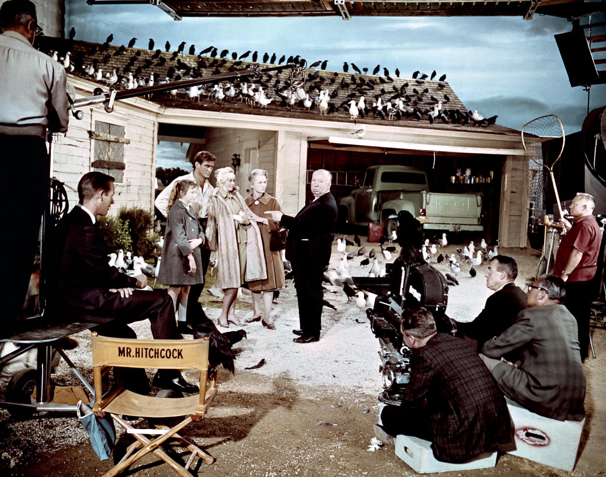 British actress Veronica Cartwright, Australian actor Rod Taylor, American actress Tippi Hedren and British Jessica Tandy with director and producer Alfred Hitchcock on the set of Hitchcock's movie The Birds. (Photo by Universal Pictures/Sunset Boulevard/Corbis via Getty Images)