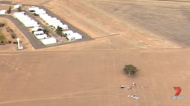 It is believed the trike was circling the airport for quite some time before it came crashing down into a paddock 500 metres away. Photo: 7 News