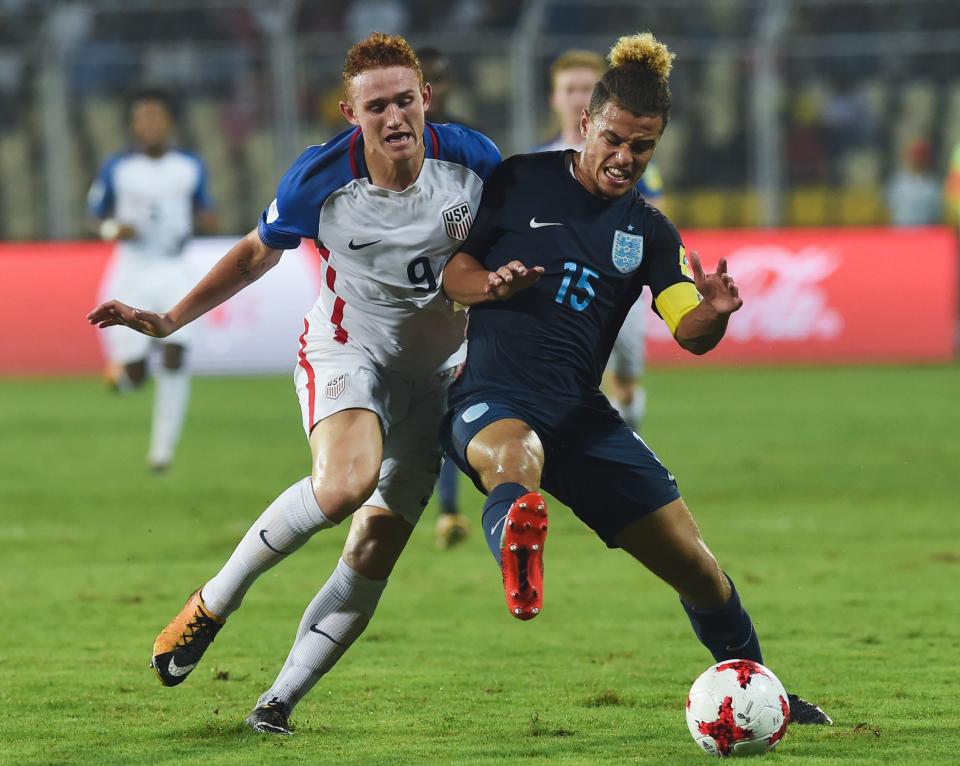 United States striker Josh Sargent (9) battles England’s Joel Latibeaudiere on Saturday in Goa, India. (Getty)