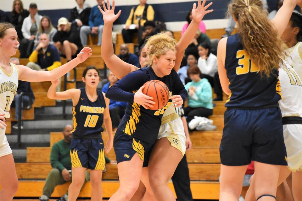 Mooresville's Rachel Harshman fights contact during the Pioneers' matchup with Cathedral on Jan. 1, 2023.