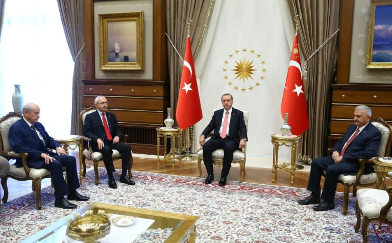 L-R: Turkey's Chairman of the Nationalist Movement Party Devlet Bahceli, Chairman of Republican People's Party Kemal Kilicdaroglu, President Recep Tayyip Erdogan, and Prime Minister Binali Yildirim pose during a meeting in Ankara