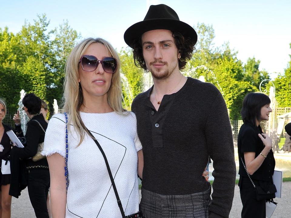 Sam Taylor-Wood and Aaron Johnson attend the Chanel 2012/13 Cruise Collection at Chateau de Versailles on May 14, 2012 in Versailles, France