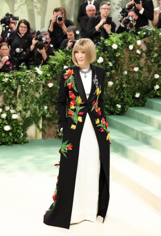 <p>Aliah Anderson/Getty Images</p><p>Wintour started off the night strong in a jacket with floral embellishments. </p>